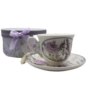 An image of teacup and saucer with a box behind it.