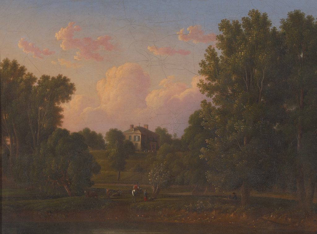 An image of a small yellow house on a hill. Hill side leads down to a river where there are two men and some cows on the banks. Surrounding the house and the hill are trees and foliage.