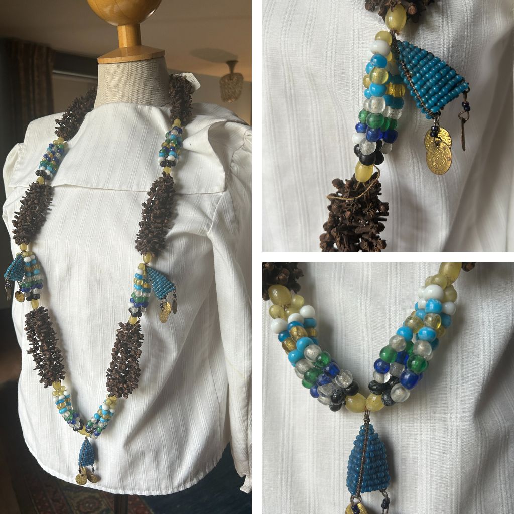 A grid image. The left side has a mannequin with a white blouse. There is a large necklace with green and blue beads as well as coins. On the right there are close ups of the necklace.