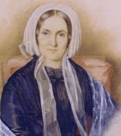 An image of a woman in a white bonnet.